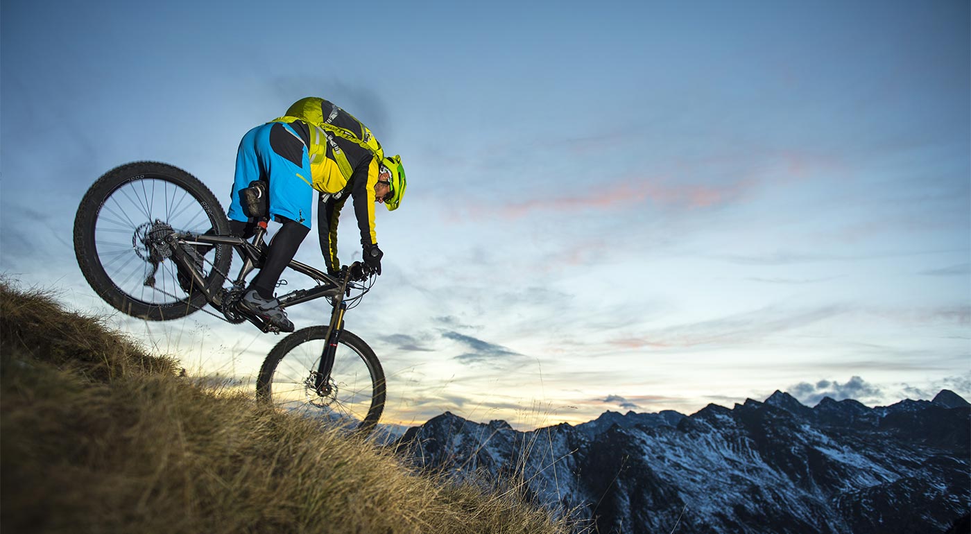 Mountain Biker doing downhill in the woods